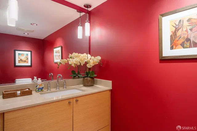 a bathroom with a sink and a mirror