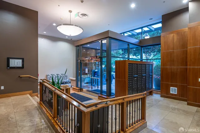 a view of a hallway with furniture