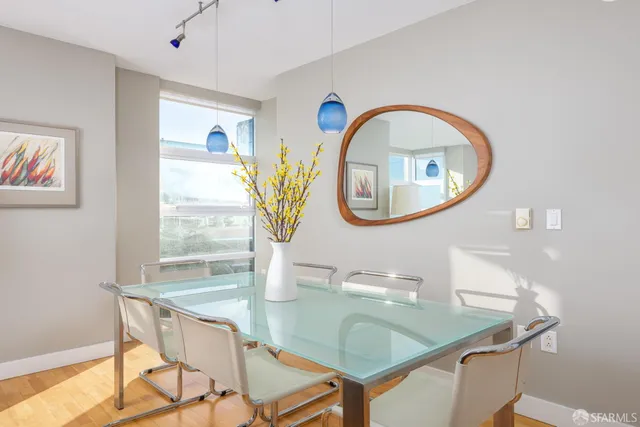 a dining room with a table and chairs