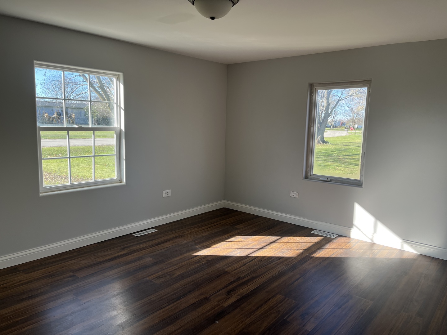 1351 4483rd Road Earlville, IL 60518 - Photo 14 of 30 a view of an empty room with wooden floor and a window