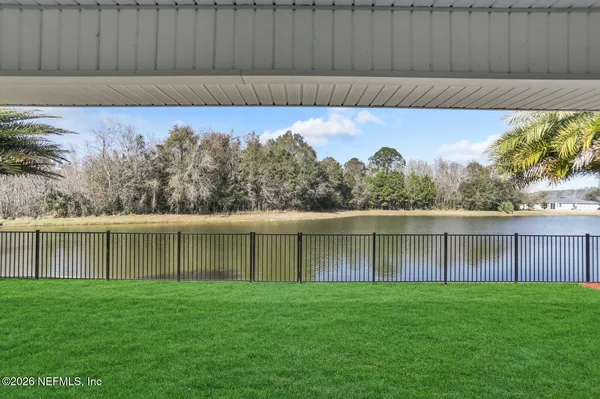 a view of a backyard with a large pool