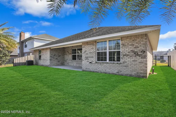 a backyard of a house with lots of green space