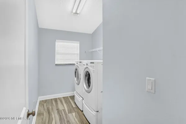 a utility room with dryer and washer
