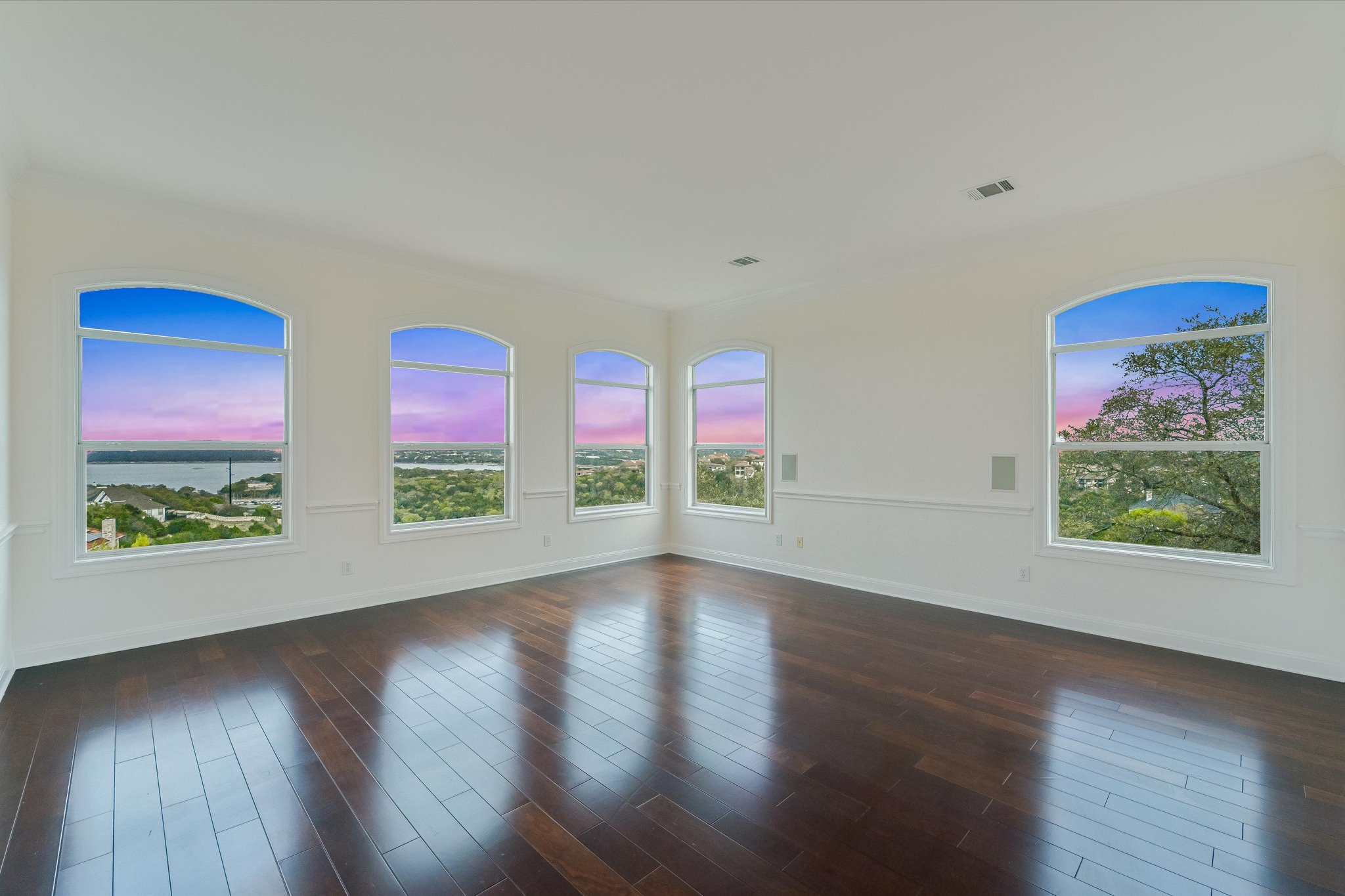 4319 Rum Runner Road Austin, TX 78734 - Photo 15 of 40 a view of an empty room with wooden floor and window