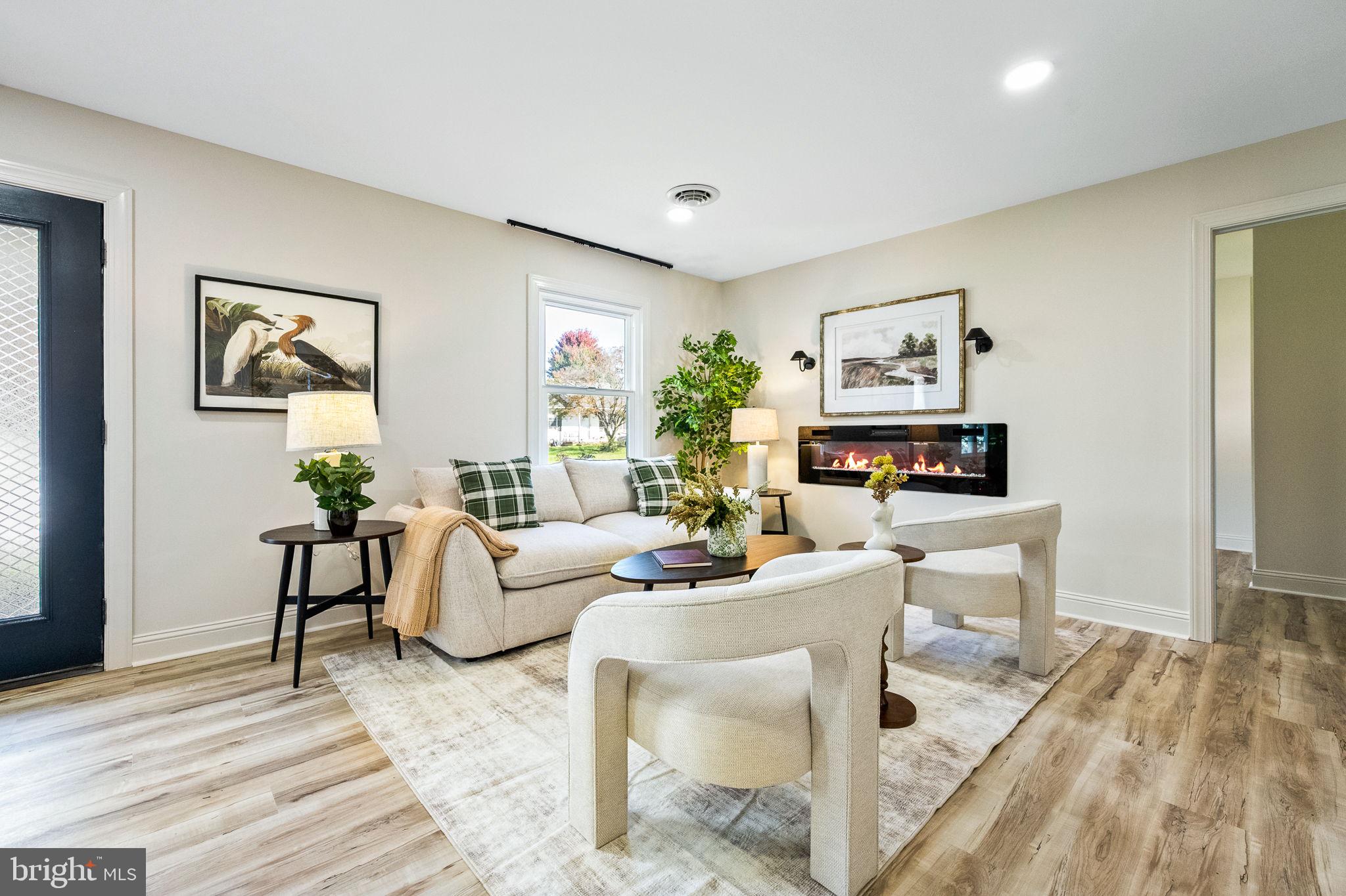 178 Fulton Avenue Charles Town, WV 25414 - Photo 16 of 30 a living room with furniture and a wooden floor
