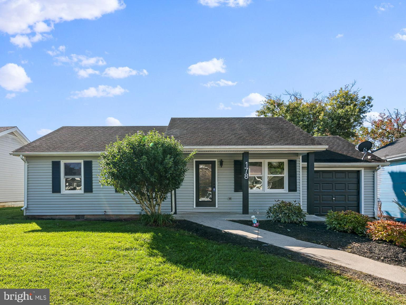 178 Fulton Avenue Charles Town, WV 25414 - Photo 2 of 30 a front view of a house with yard and green space