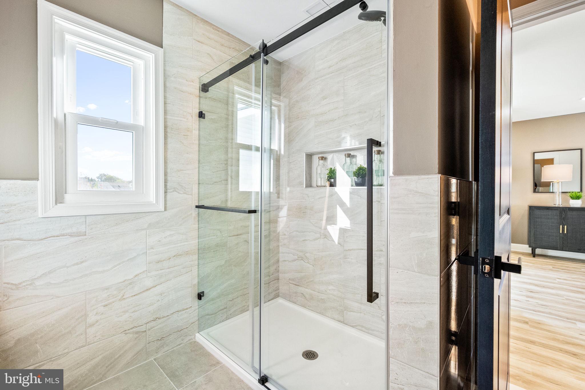 178 Fulton Avenue Charles Town, WV 25414 - Photo 27 of 30 a bathroom with a glass shower door