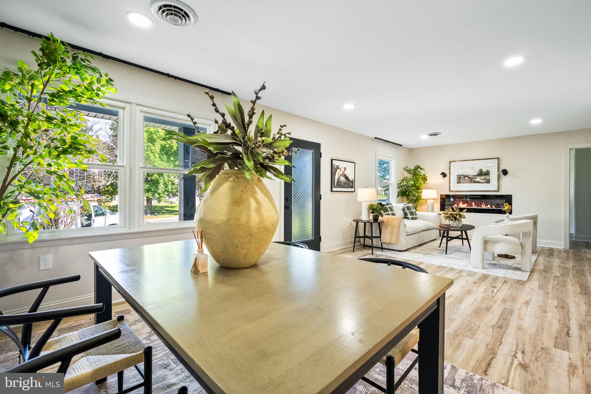 178 Fulton Avenue Charles Town, WV 25414 - Photo 8 of 30 a view of a dining room with furniture and a potted plant