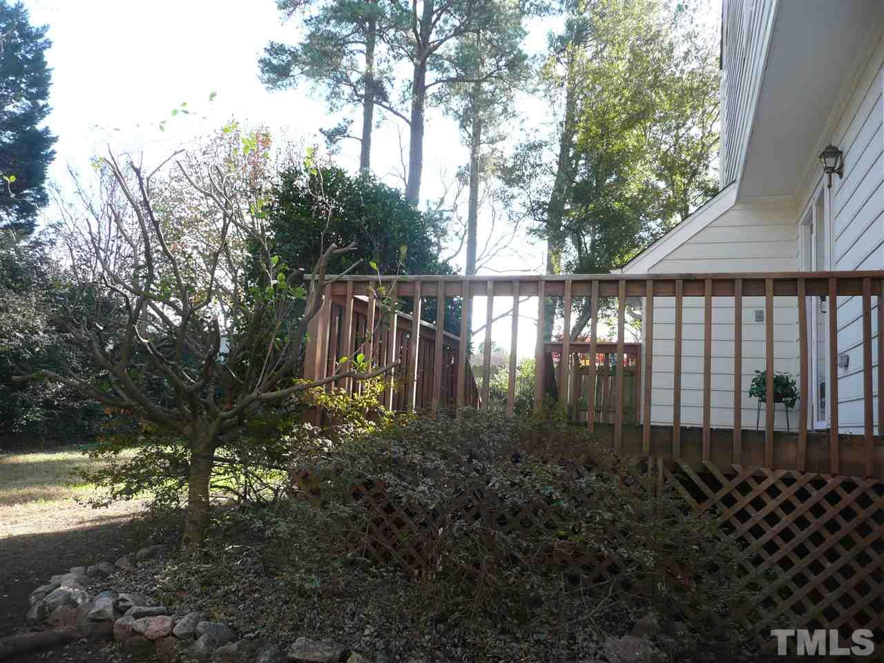 4024 Iron Horse Road Raleigh, NC 27616 - Photo 24 of 25 a view of backyard with large trees and wooden fence