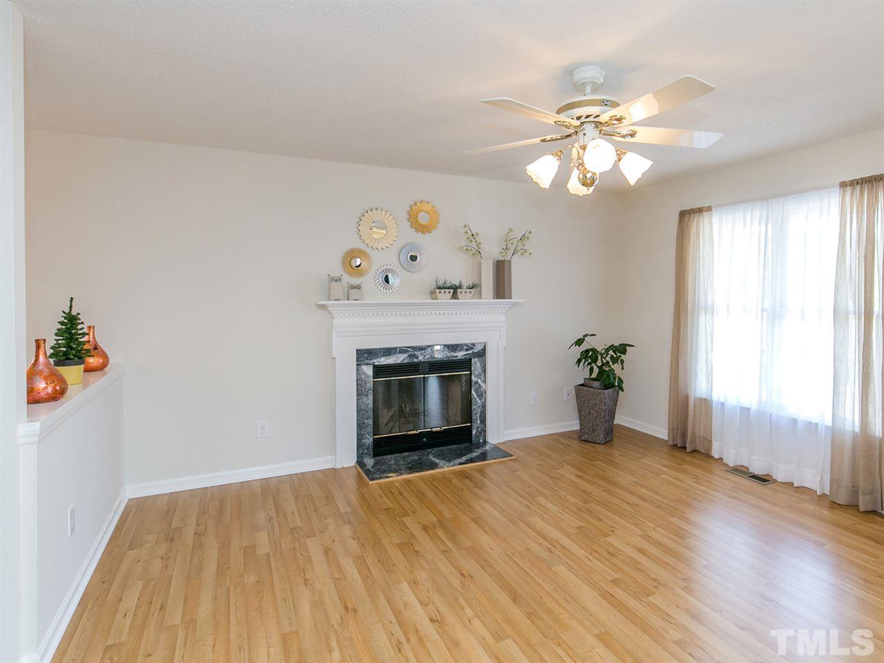 4024 Iron Horse Road Raleigh, NC 27616 - Photo 5 of 25 a view of an empty room with a window and fireplace