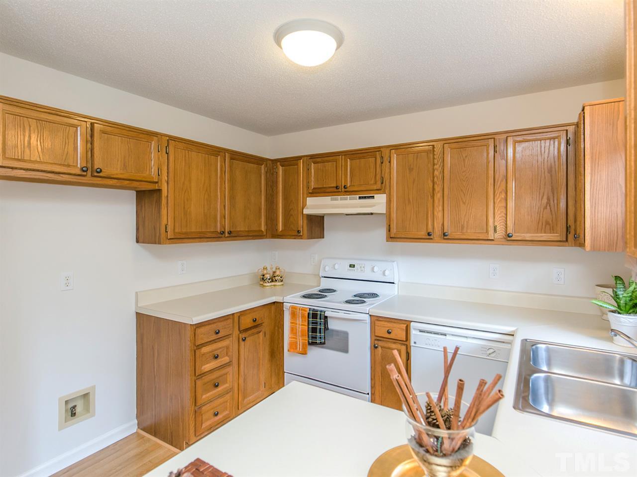 4024 Iron Horse Road Raleigh, NC 27616 - Photo 8 of 25 a kitchen with stainless steel appliances granite countertop a sink stove and cabinets