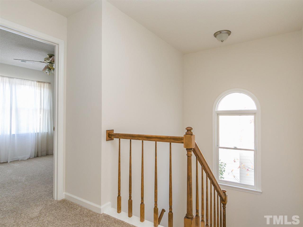 4024 Iron Horse Road Raleigh, NC 27616 - Photo 9 of 25 a view of staircase with railing and a window