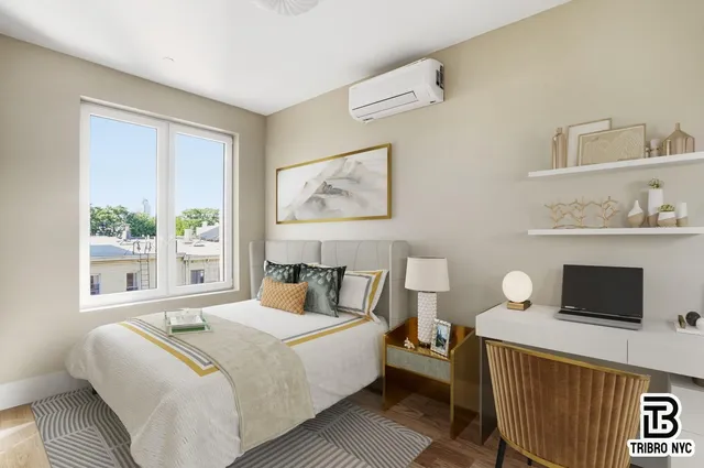 a bedroom with a bed and a window