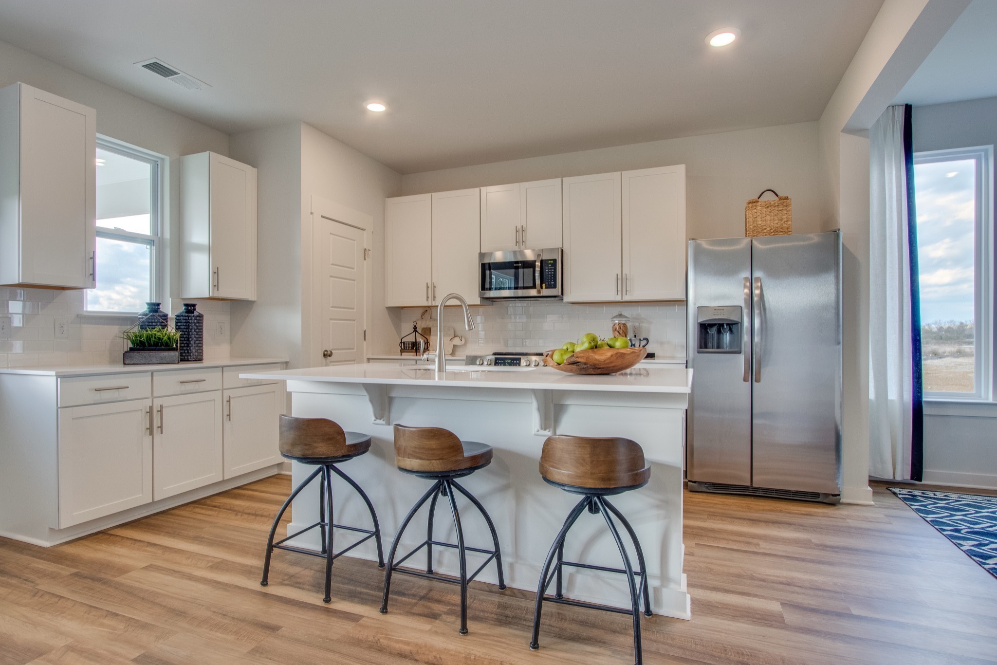 219 Goldfinch Road Mount Juliet, TN 37122 - Photo 12 of 23 a kitchen with white cabinets and stainless steel appliances