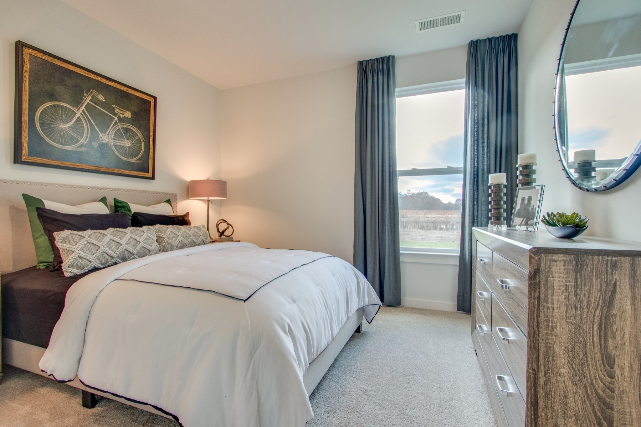 219 Goldfinch Road Mount Juliet, TN 37122 - Photo 18 of 23 a bedroom with a large bed and a mirror