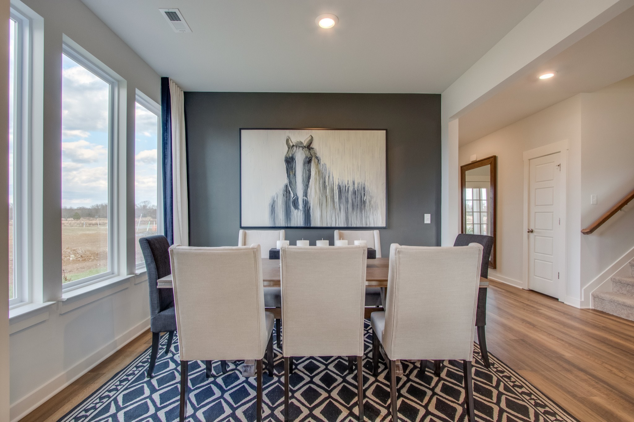 219 Goldfinch Road Mount Juliet, TN 37122 - Photo 4 of 23 a living room with furniture a large window and wooden floor