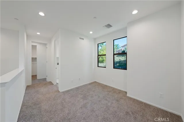 an empty room with windows