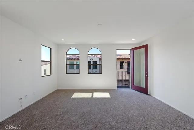 a view of empty room with windows