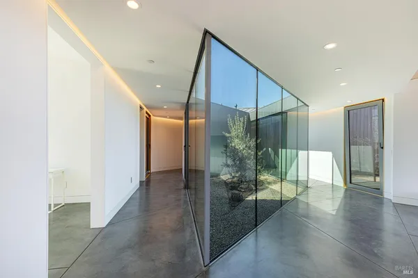 a view of a swimming pool with a couches in a patio