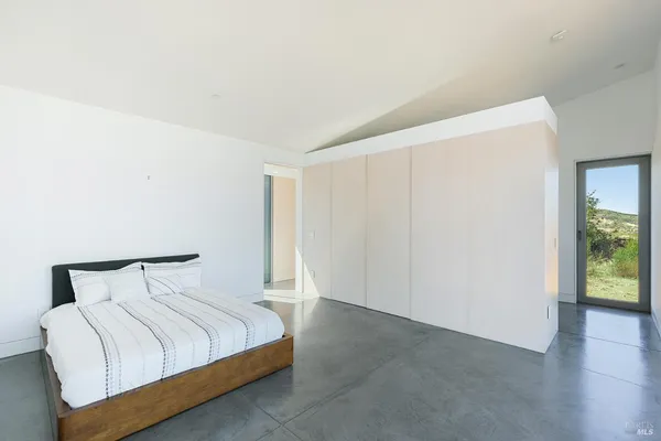 a view of a hallway view with a living room