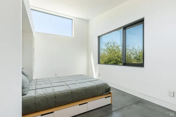 a hallway with a glass door and an entryway