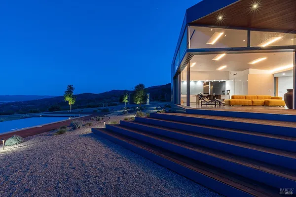 an aerial view of a house with a garden