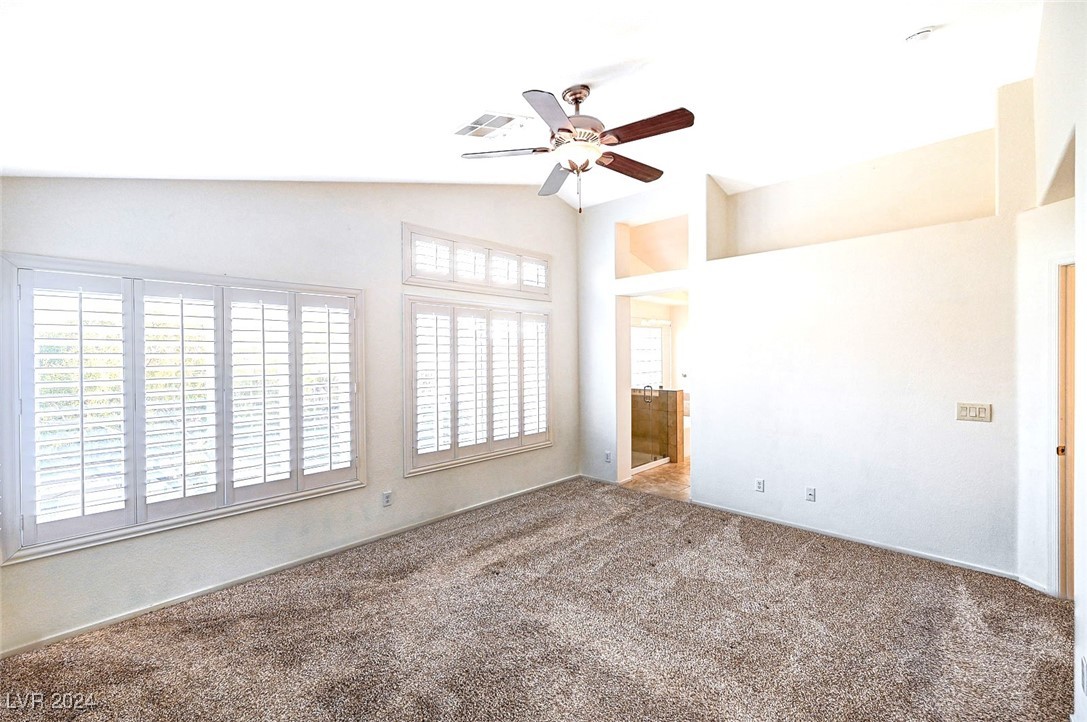 1708 Jack Rabbit Way Las Vegas, NV 89128 - Photo 10 of 16 Primary bedroom with vaulted ceilings