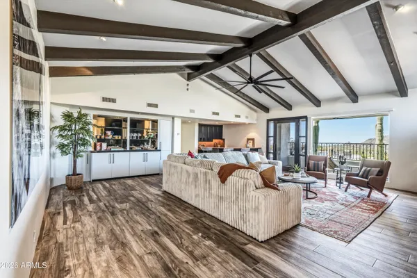 a view of a living room and kitchen
