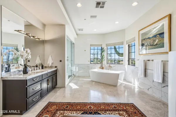 an aerial view of a house with a mountain