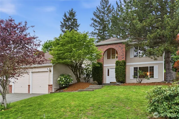 front view of a house with a yard