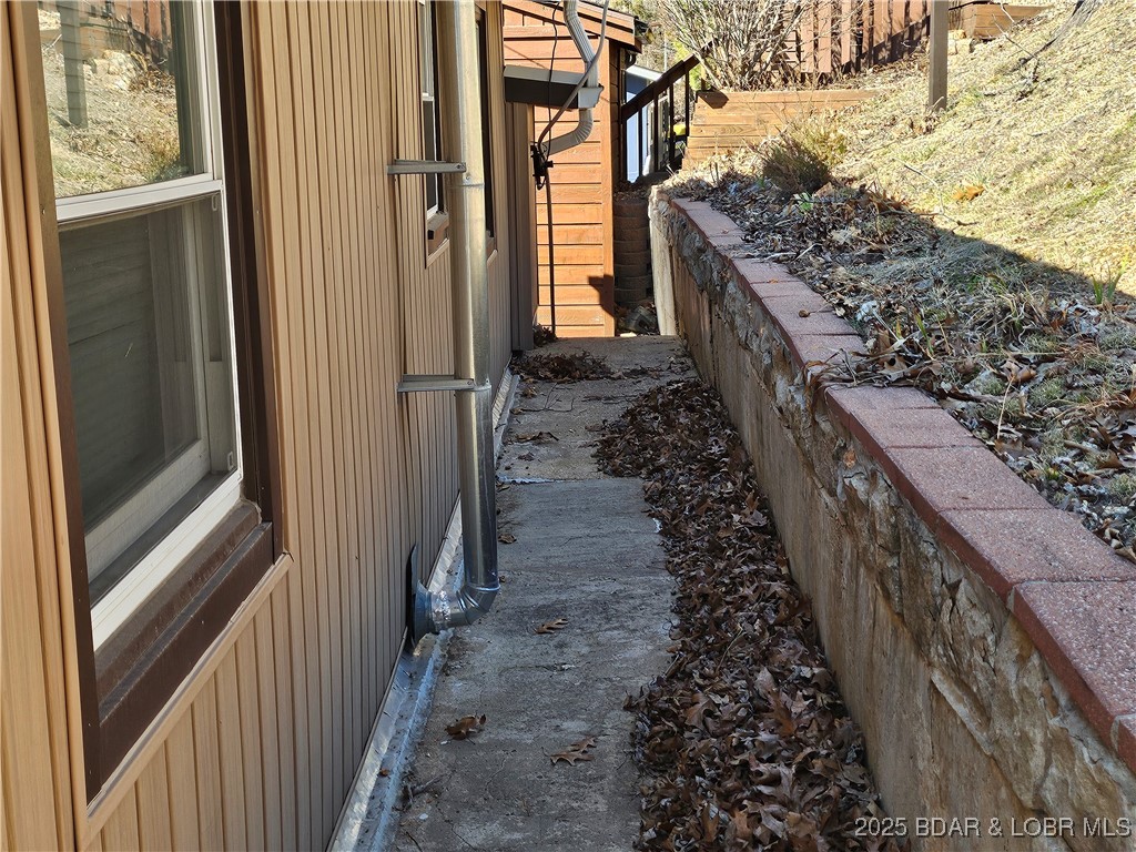 33 Zebco Court Edwards, MO 65326 - Photo 13 of 50 Walkway runs behind the house, can get to both sid