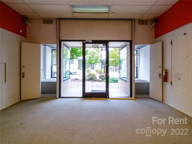 a view of empty room with floor to ceiling window