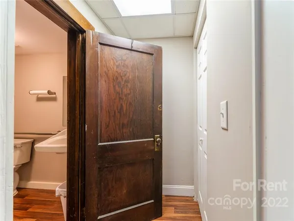 a bathroom with a shower and a sink