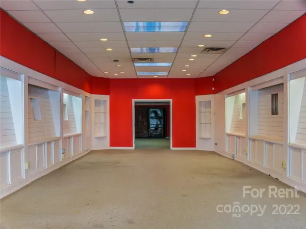 a view of an empty room with windows