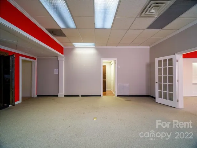 a view of an empty room with closet