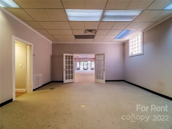 a view of an empty room with a window