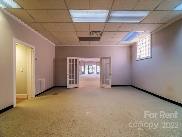a view of an empty room with a window
