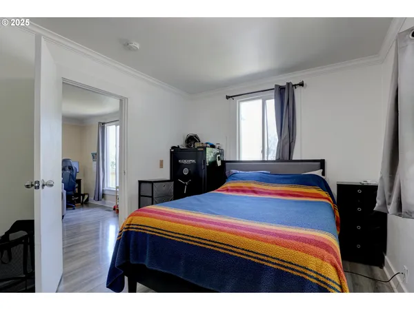 a bedroom with a bed and a dresser