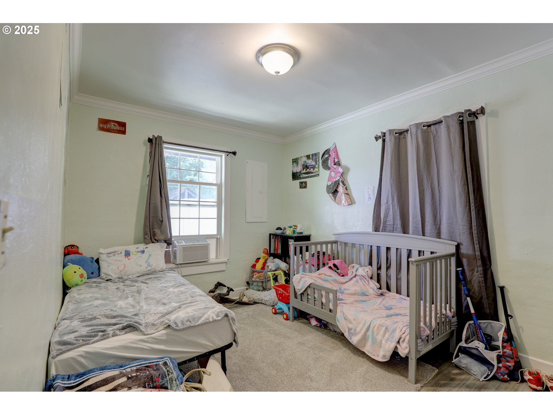 804 East 13th Street The Dalles, OR 97058 - Photo 7 of 20 a bedroom with a bed and a window