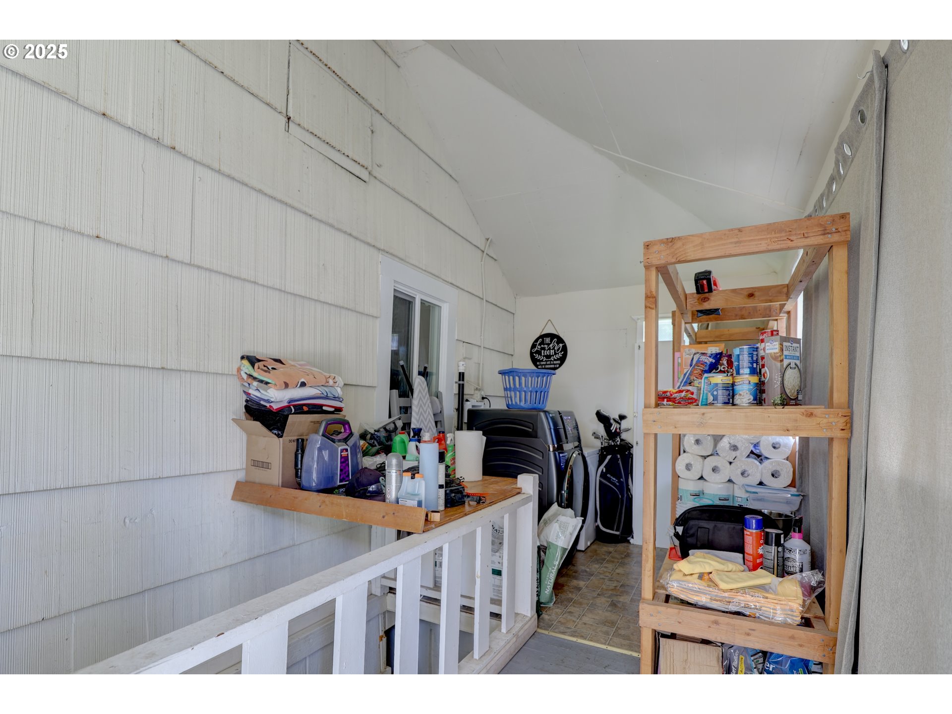 804 East 13th Street The Dalles, OR 97058 - Photo 8 of 20 a view of a hallway with workspace and a fireplace
