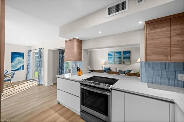 a kitchen with a stove and a sink