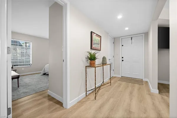 a spacious bedroom with a bed and a couch