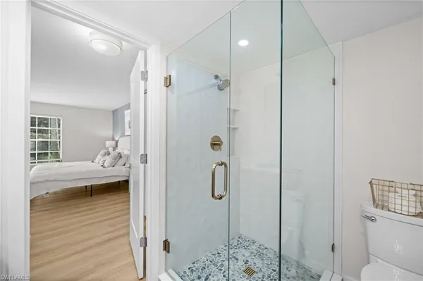 a en suite bathroom with a double vanity sink and a mirror