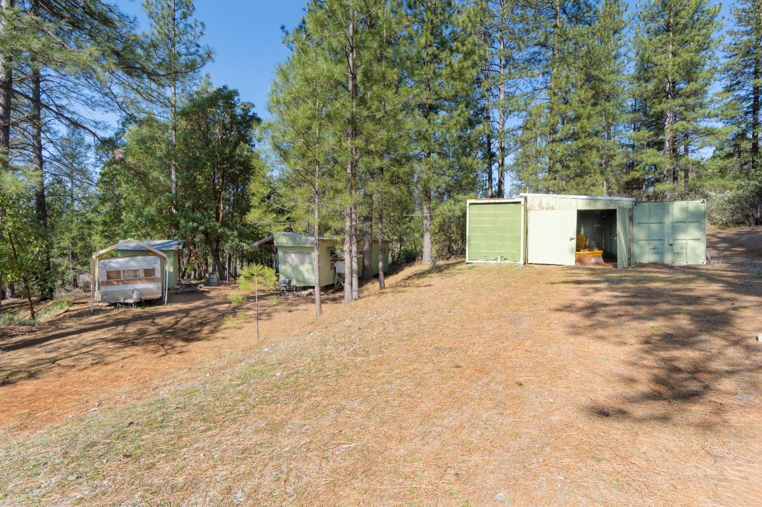 6281 Bear Creek Road Garden Valley, CA 95633 - Photo 40 of 51 a view of a house with large trees and playing area