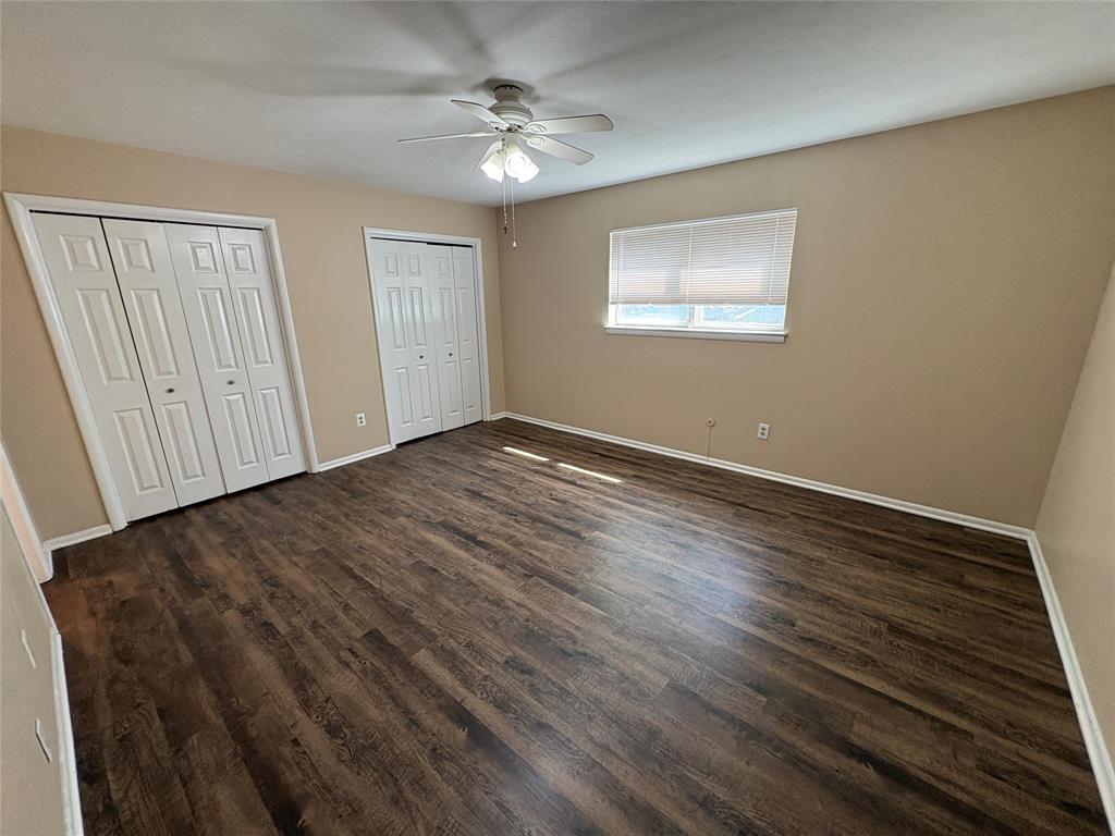 1111 Duane Street Benbrook, TX 76126 - Photo 16 of 28 wooden floor in an empty room with a window