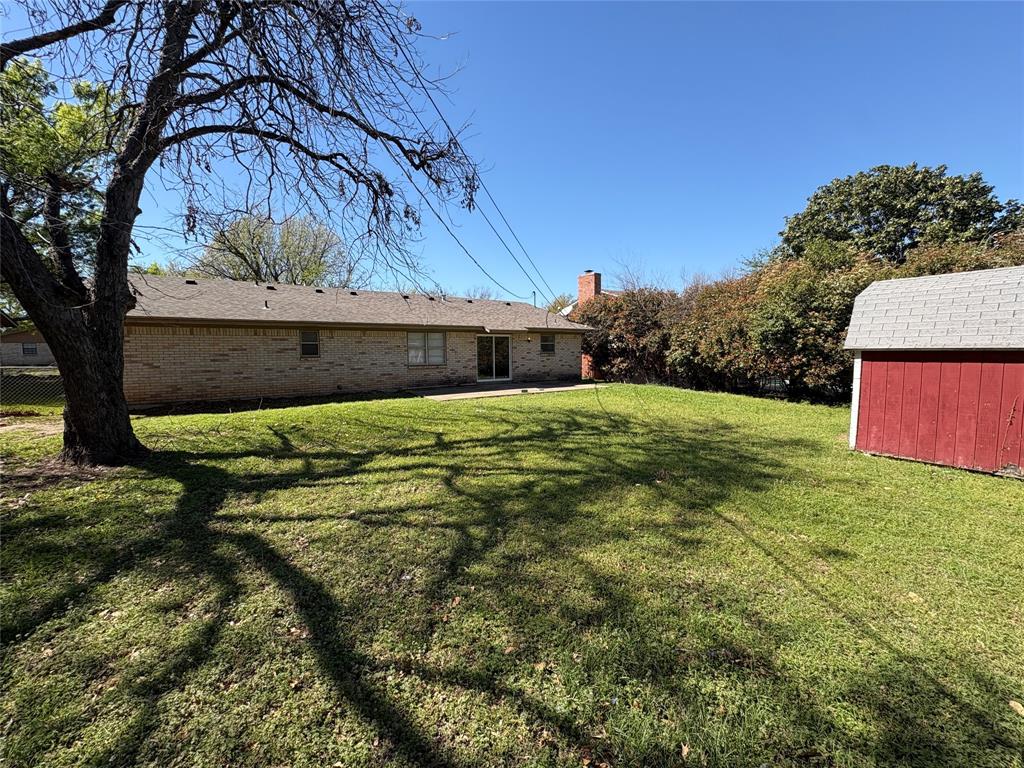 1111 Duane Street Benbrook, TX 76126 - Photo 26 of 28 a view of a back yard of the house