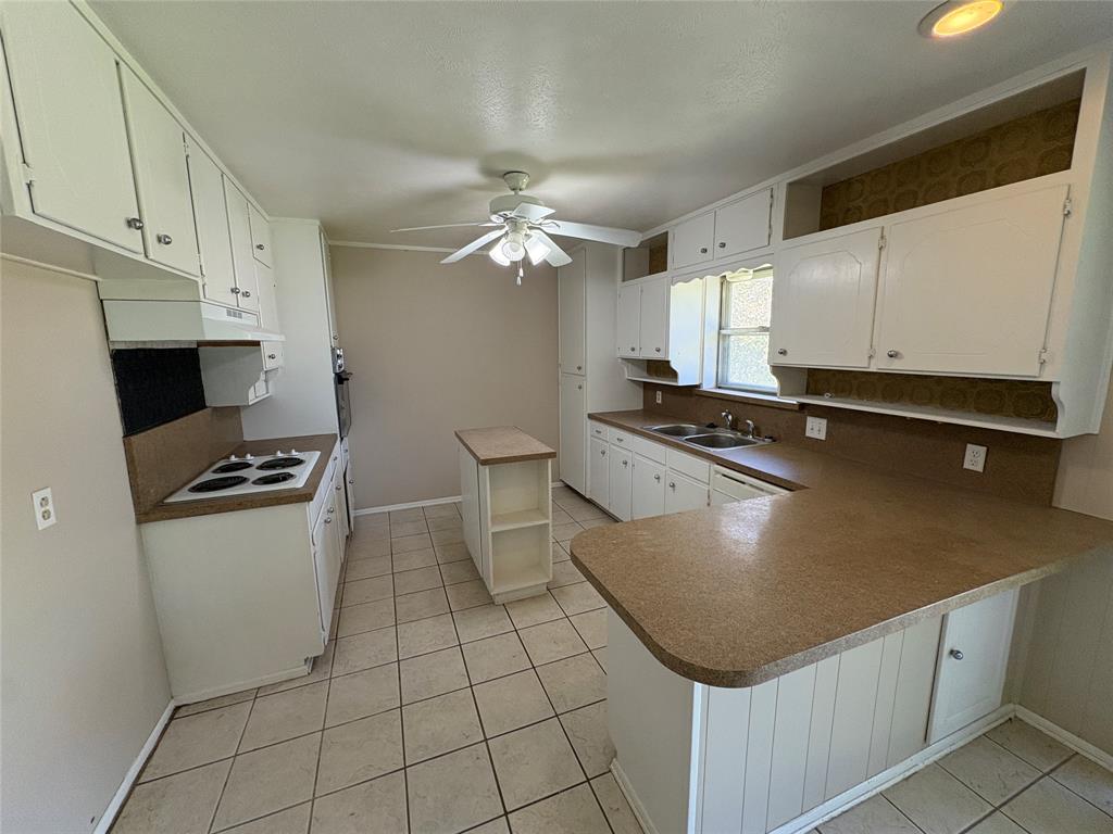1111 Duane Street Benbrook, TX 76126 - Photo 10 of 28 a kitchen with stainless steel appliances granite countertop a stove a sink dishwasher and a refrigerator