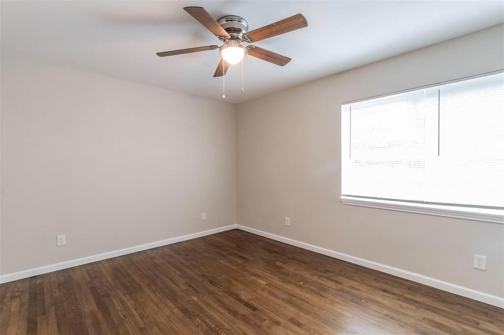 4714 Old Benbrook Road Fort Worth, TX 76116 - Photo 7 of 15 an empty room with a window and a fan
