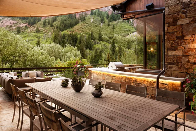 a outdoor living space with patio furniture and a fireplace