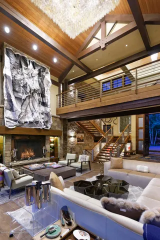 a view of a dining room with furniture and a floor to ceiling window